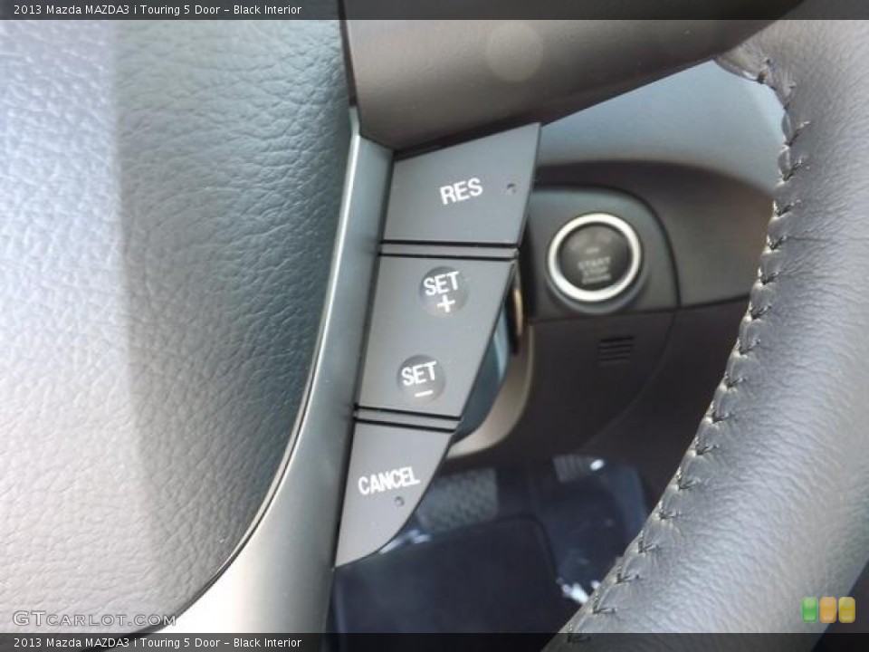 Black Interior Controls for the 2013 Mazda MAZDA3 i Touring 5 Door #78994318