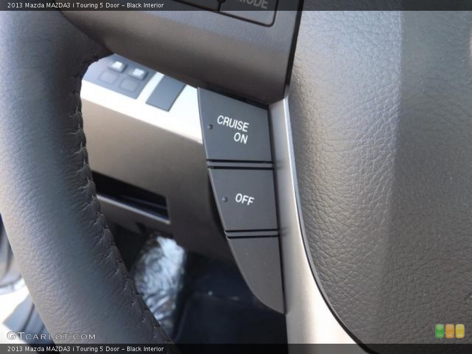Black Interior Controls for the 2013 Mazda MAZDA3 i Touring 5 Door #78994326