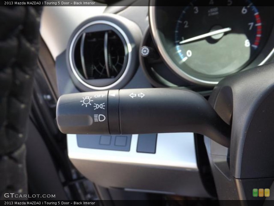 Black Interior Controls for the 2013 Mazda MAZDA3 i Touring 5 Door #78994348