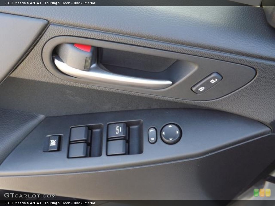 Black Interior Controls for the 2013 Mazda MAZDA3 i Touring 5 Door #78994390