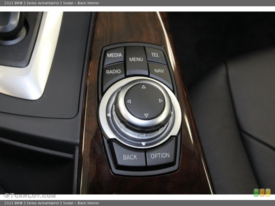 Black Interior Controls for the 2013 BMW 3 Series ActiveHybrid 3 Sedan #79274258