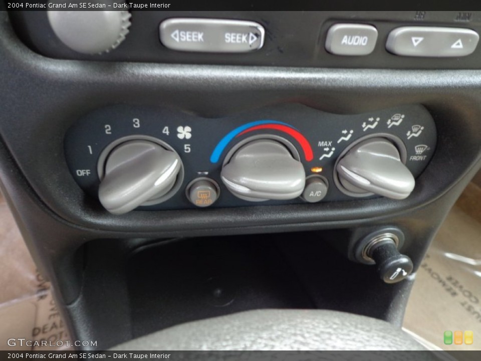 Dark Taupe Interior Controls for the 2004 Pontiac Grand Am SE Sedan #79309850