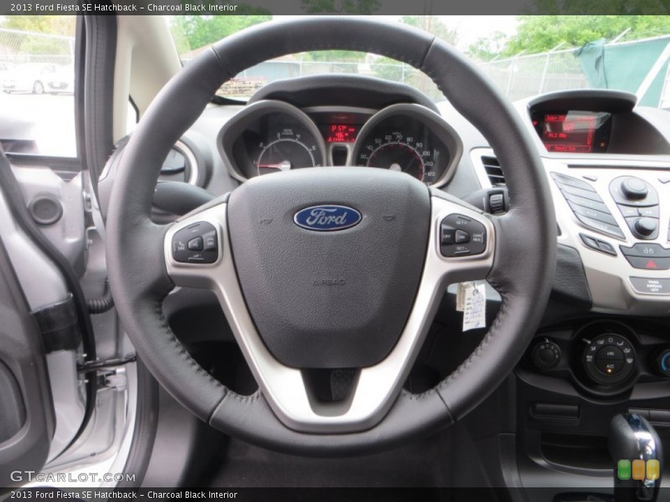 Charcoal Black Interior Steering Wheel for the 2013 Ford Fiesta SE Hatchback #79368928