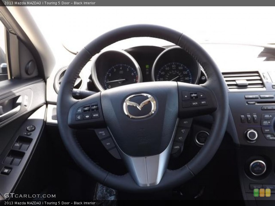 Black Interior Steering Wheel for the 2013 Mazda MAZDA3 i Touring 5 Door #79441331