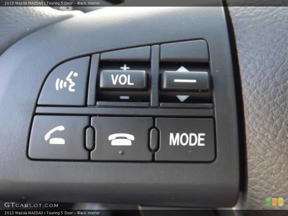 Black Interior Controls for the 2013 Mazda MAZDA3 i Touring 5 Door #79441379