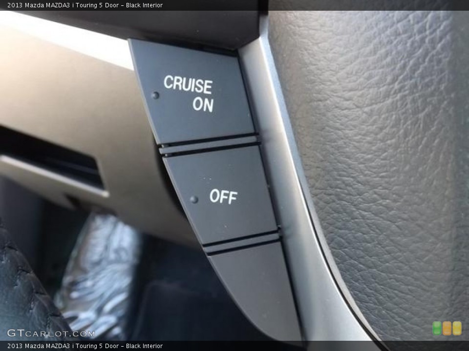 Black Interior Controls for the 2013 Mazda MAZDA3 i Touring 5 Door #79441392