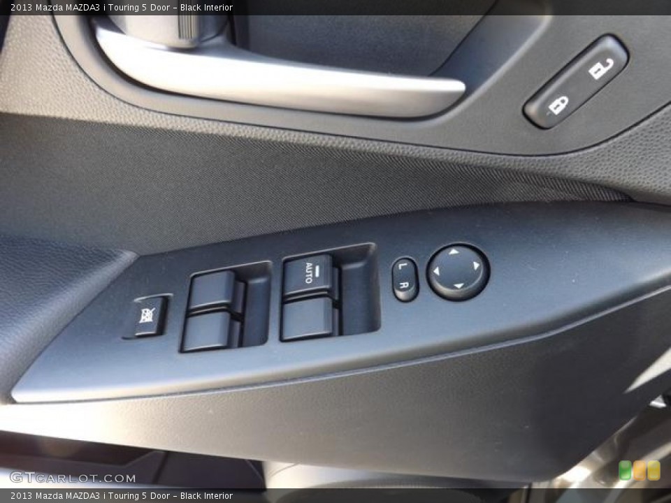 Black Interior Controls for the 2013 Mazda MAZDA3 i Touring 5 Door #79441516