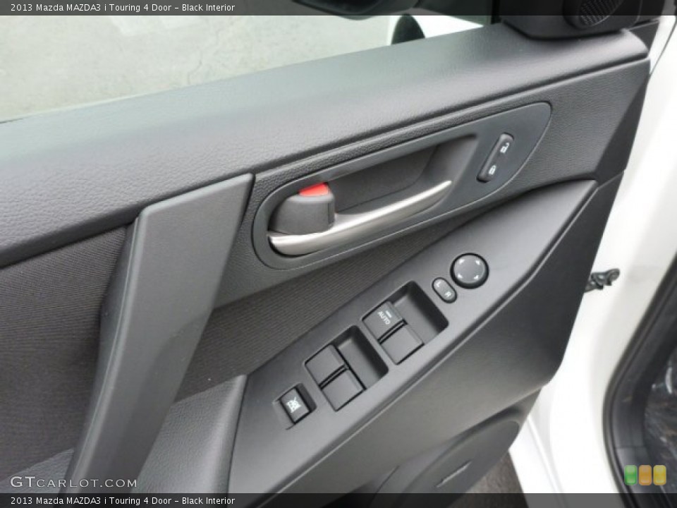 Black Interior Controls for the 2013 Mazda MAZDA3 i Touring 4 Door #79481519