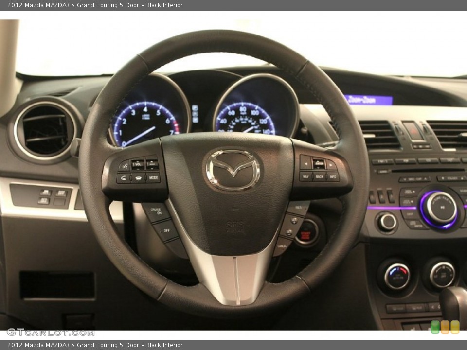Black Interior Steering Wheel for the 2012 Mazda MAZDA3 s Grand Touring 5 Door #79529602