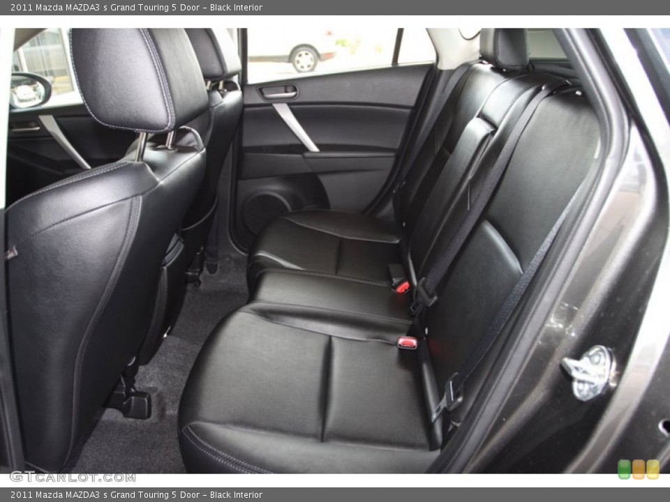Black Interior Rear Seat for the 2011 Mazda MAZDA3 s Grand Touring 5 Door #79537216
