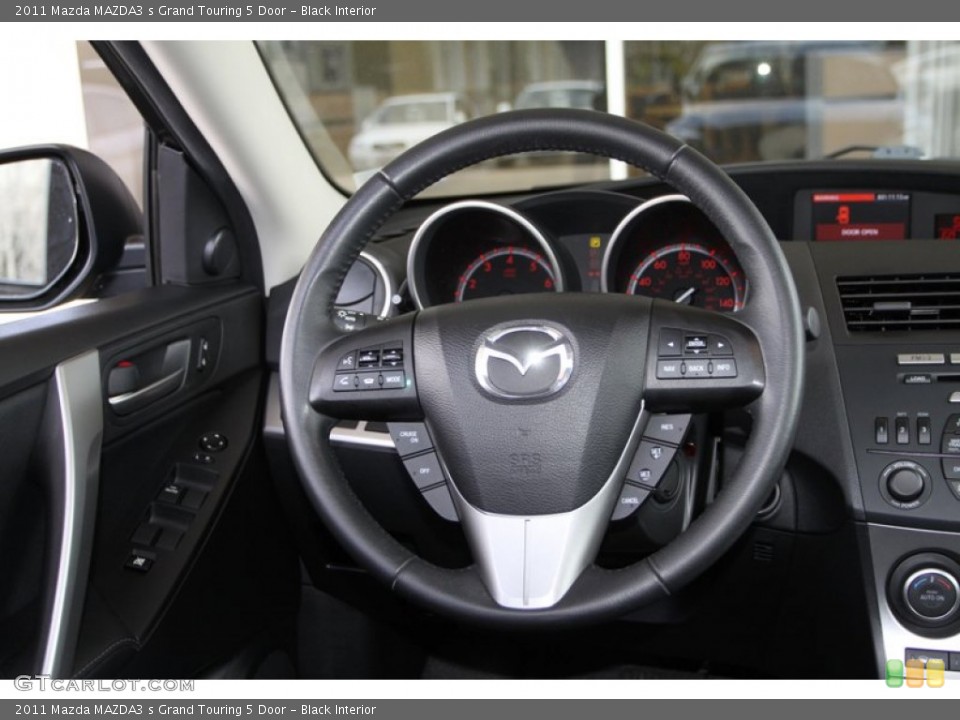 Black Interior Steering Wheel for the 2011 Mazda MAZDA3 s Grand Touring 5 Door #79537243