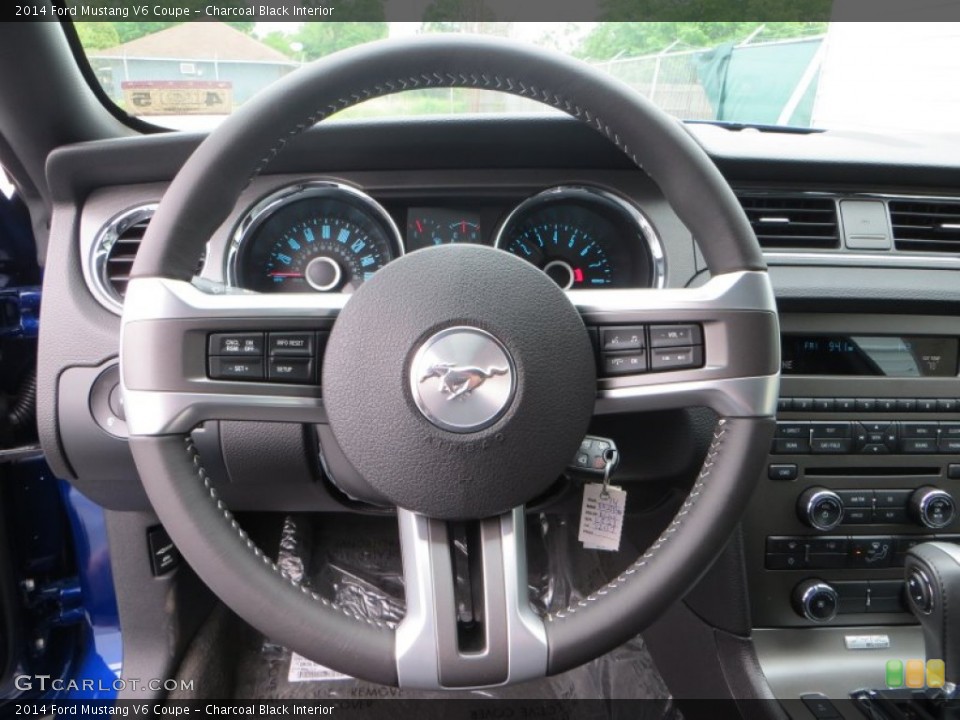 Charcoal Black Interior Steering Wheel for the 2014 Ford Mustang V6 Coupe #79543531