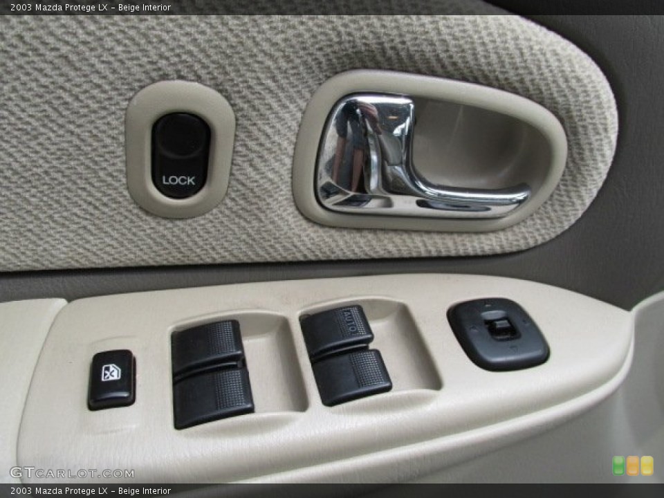 Beige Interior Controls for the 2003 Mazda Protege LX #79647740