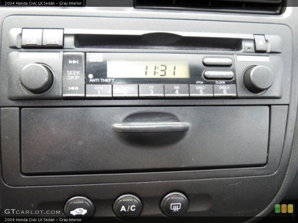 Gray Interior Audio System for the 2004 Honda Civic LX Sedan #79689362