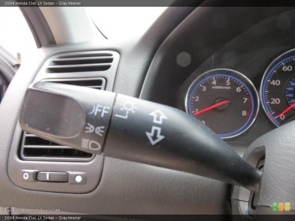 Gray Interior Controls for the 2004 Honda Civic LX Sedan #79689406