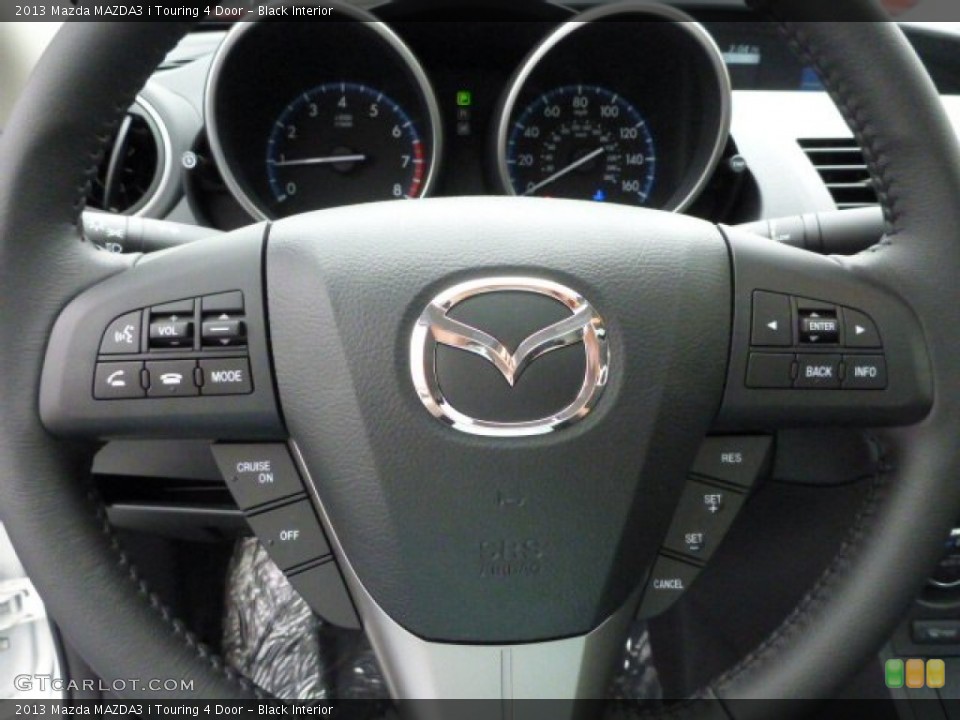 Black Interior Steering Wheel for the 2013 Mazda MAZDA3 i Touring 4 Door #79753524