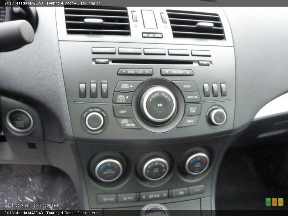 Black Interior Controls for the 2013 Mazda MAZDA3 i Touring 4 Door #79753562