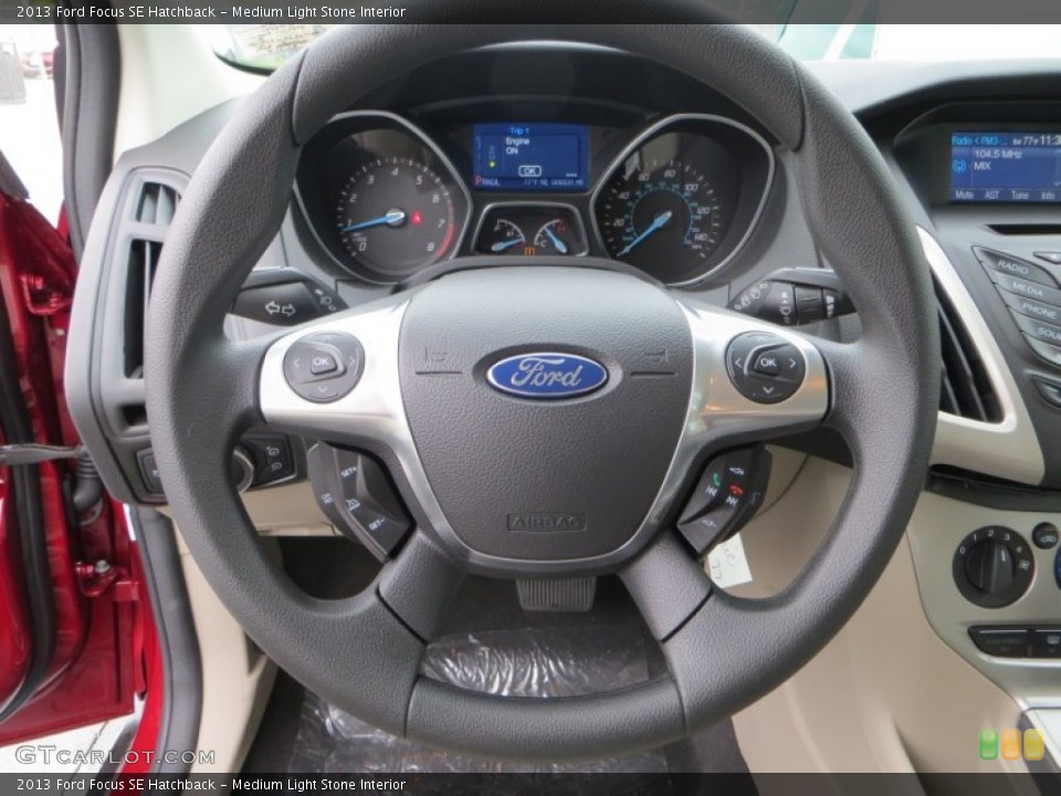 Medium Light Stone Interior Steering Wheel for the 2013 Ford Focus SE Hatchback #79899286