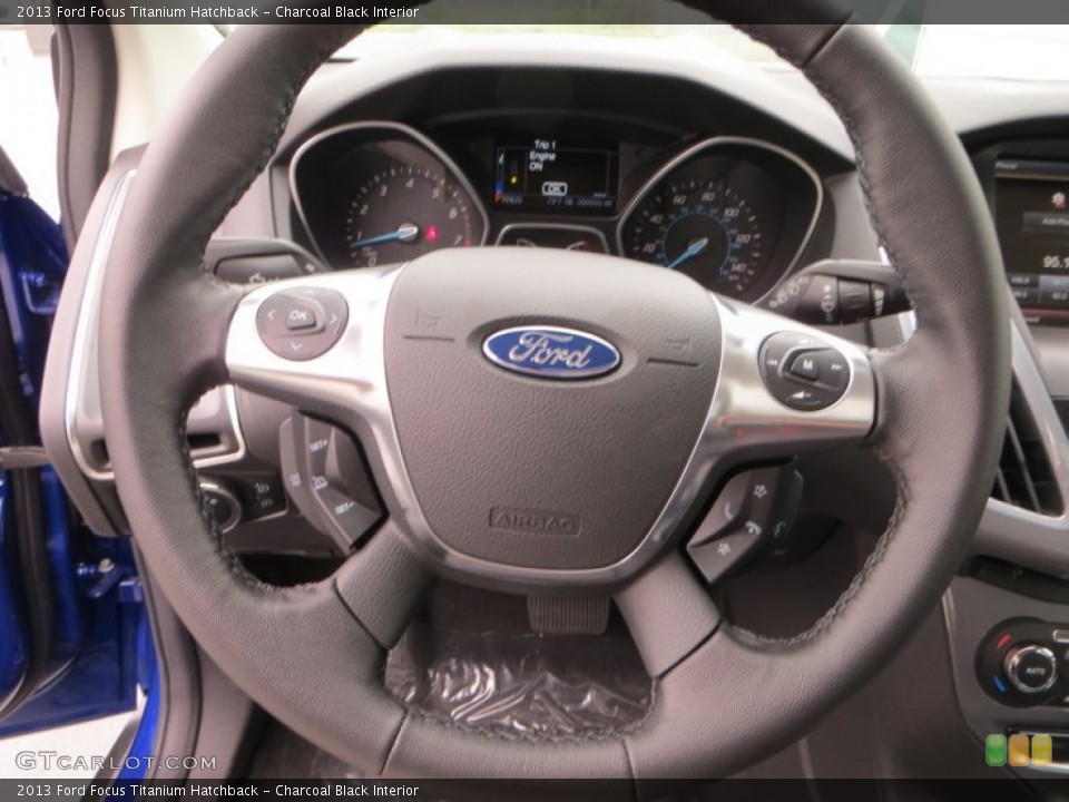 Charcoal Black Interior Steering Wheel for the 2013 Ford Focus Titanium Hatchback #79899997