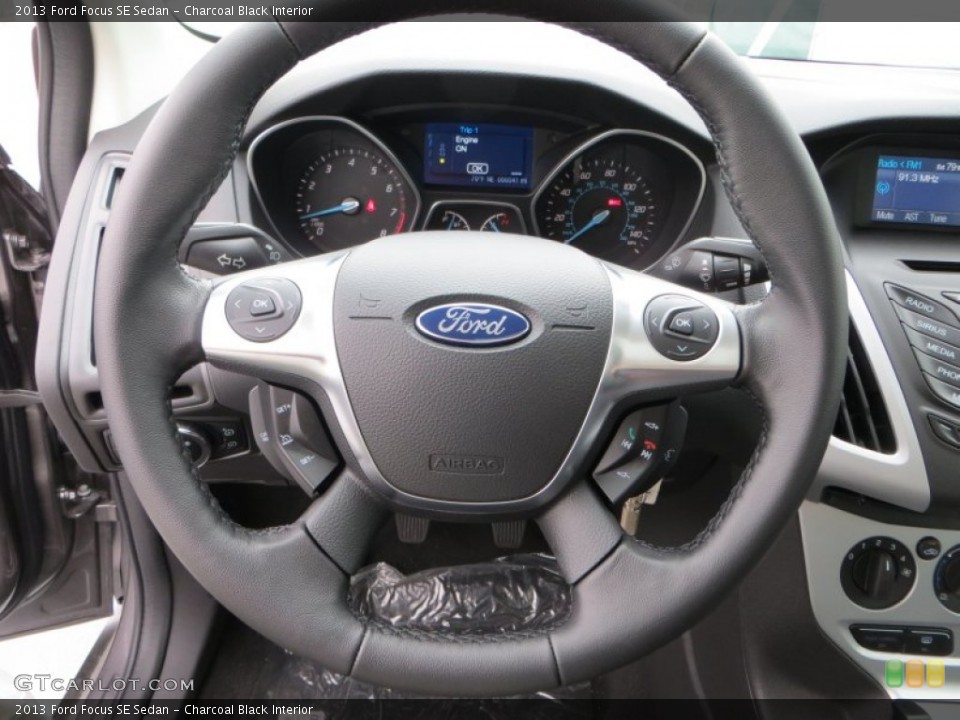 Charcoal Black Interior Steering Wheel for the 2013 Ford Focus SE Sedan #79900671