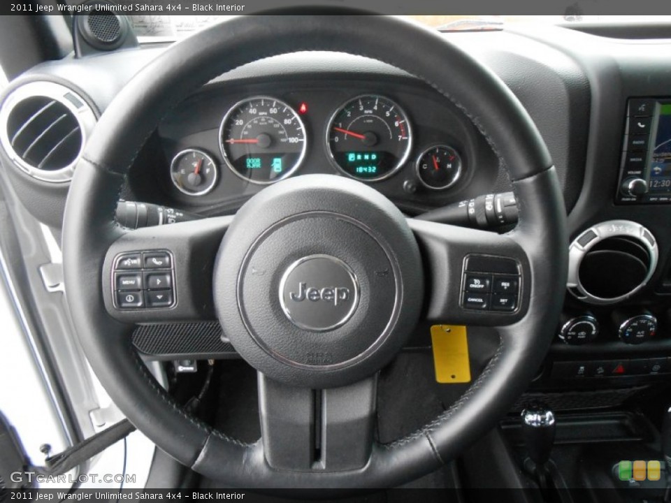 Black Interior Steering Wheel for the 2011 Jeep Wrangler Unlimited Sahara 4x4 #79977058