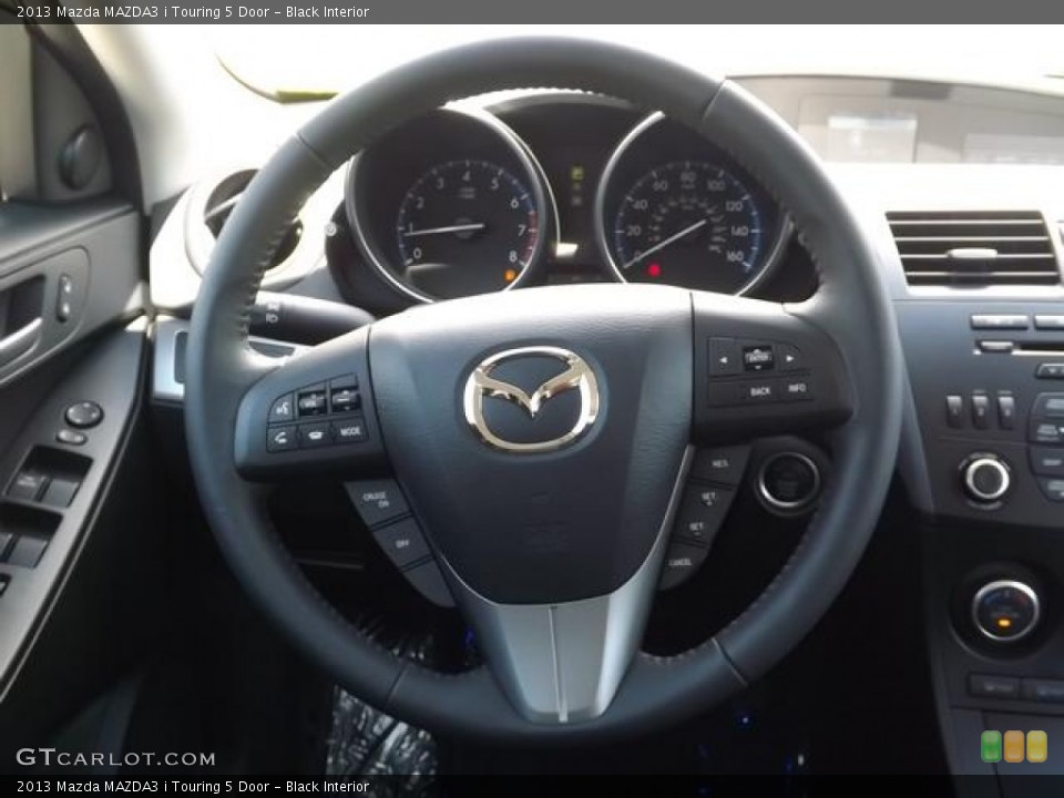 Black Interior Steering Wheel for the 2013 Mazda MAZDA3 i Touring 5 Door #80293025