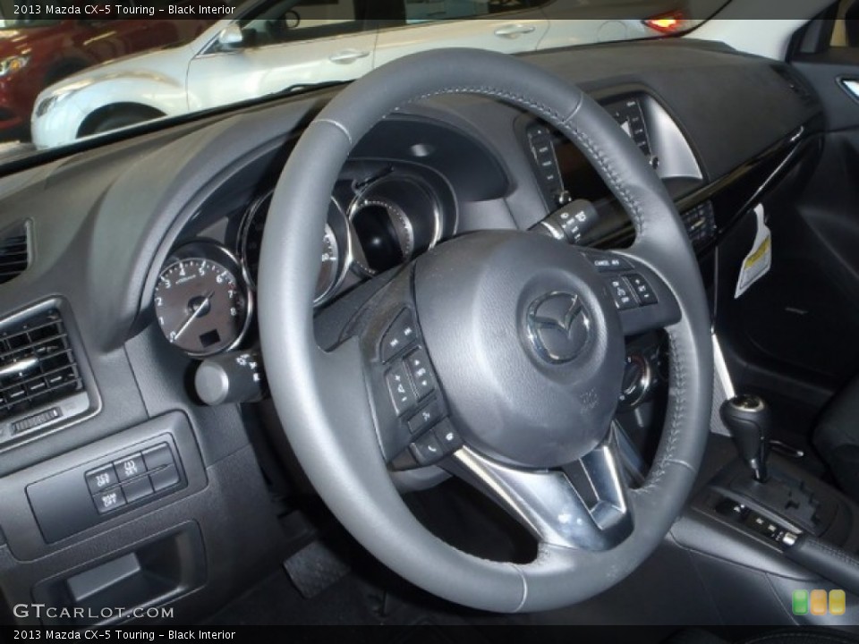 Black Interior Steering Wheel for the 2013 Mazda CX-5 Touring #80334181