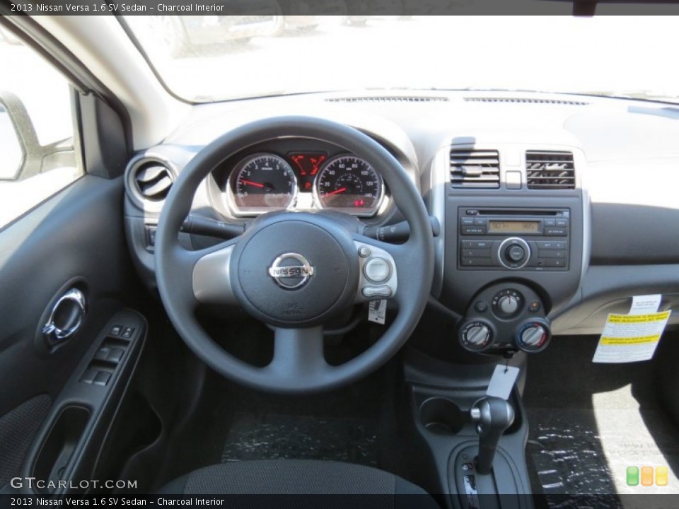 Charcoal Interior Dashboard for the 2013 Nissan Versa 1.6 SV Sedan #80340062