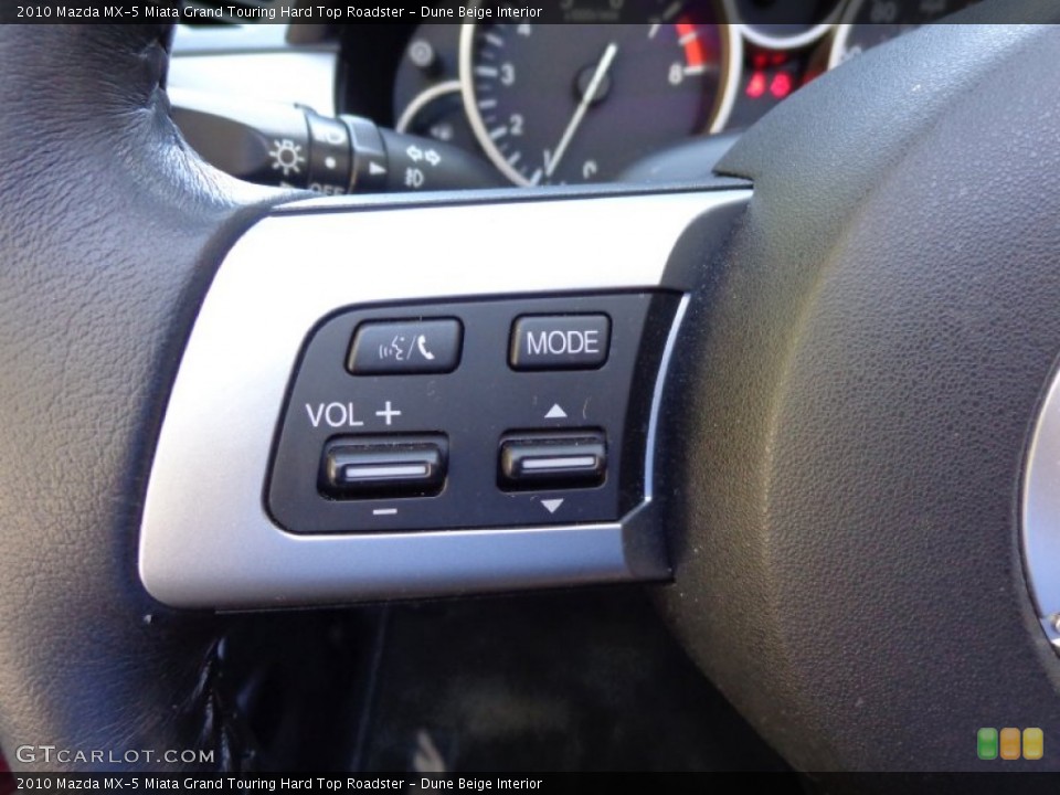 Dune Beige Interior Controls for the 2010 Mazda MX-5 Miata Grand Touring Hard Top Roadster #80590474