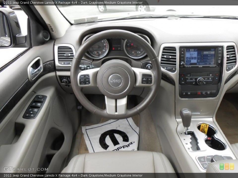 Dark Graystone/Medium Graystone Interior Dashboard for the 2011 Jeep Grand Cherokee Laredo X Package 4x4 #80702044
