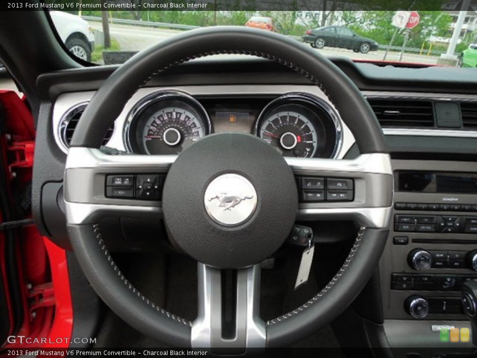 Charcoal Black Interior Steering Wheel for the 2013 Ford Mustang V6 Premium Convertible #80919856