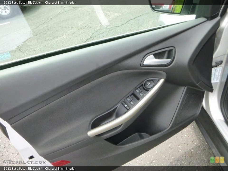 Charcoal Black Interior Door Panel for the 2012 Ford Focus SEL Sedan #80934261