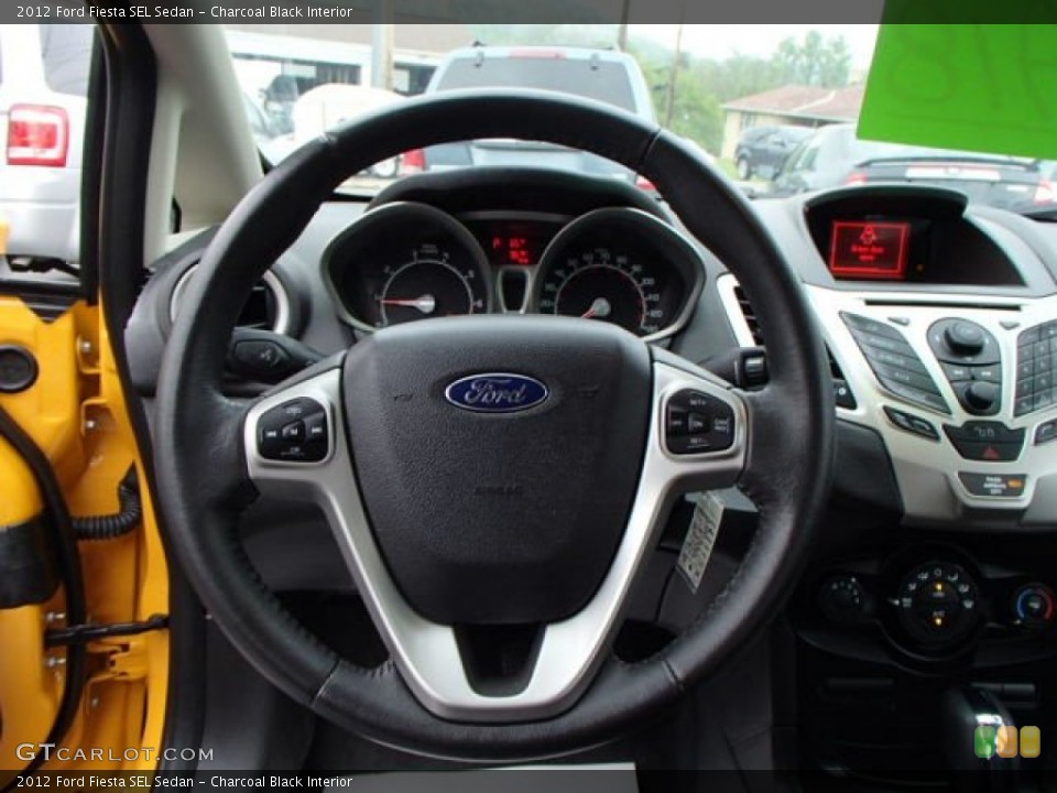Charcoal Black Interior Steering Wheel for the 2012 Ford Fiesta SEL Sedan #81198714