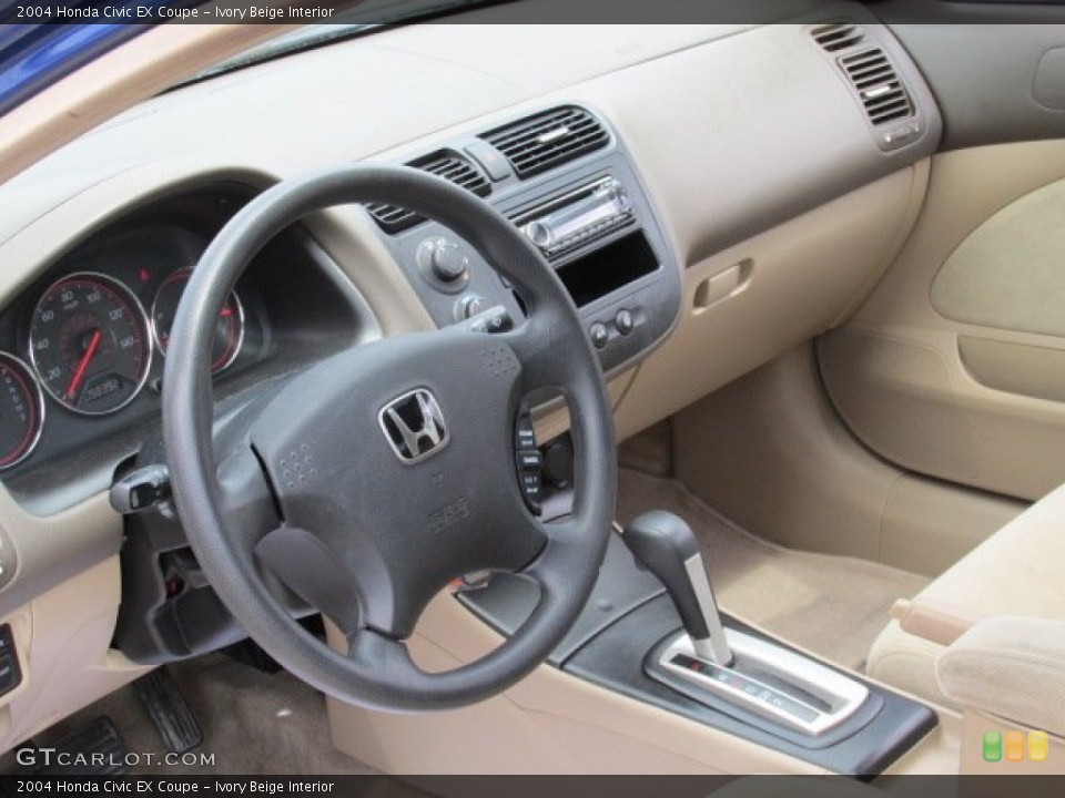 Ivory Beige Interior Dashboard for the 2004 Honda Civic EX Coupe #81219423