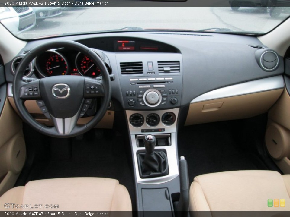 Dune Beige Interior Dashboard for the 2010 Mazda MAZDA3 s Sport 5 Door #81257827