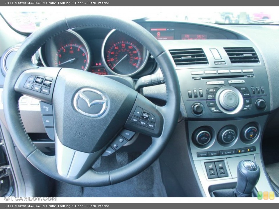 Black Interior Dashboard for the 2011 Mazda MAZDA3 s Grand Touring 5 Door #81270806