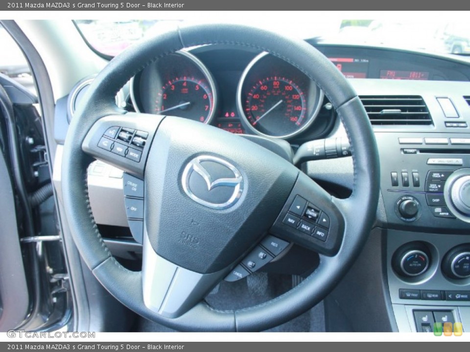 Black Interior Steering Wheel for the 2011 Mazda MAZDA3 s Grand Touring 5 Door #81270826