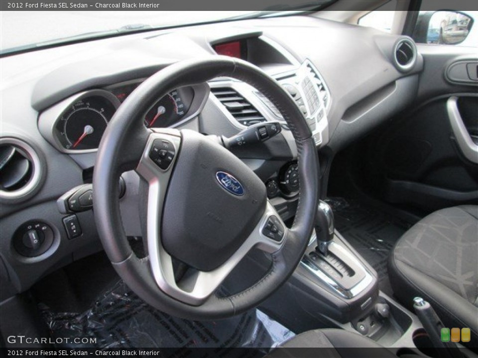 Charcoal Black Interior Dashboard for the 2012 Ford Fiesta SEL Sedan #81302510