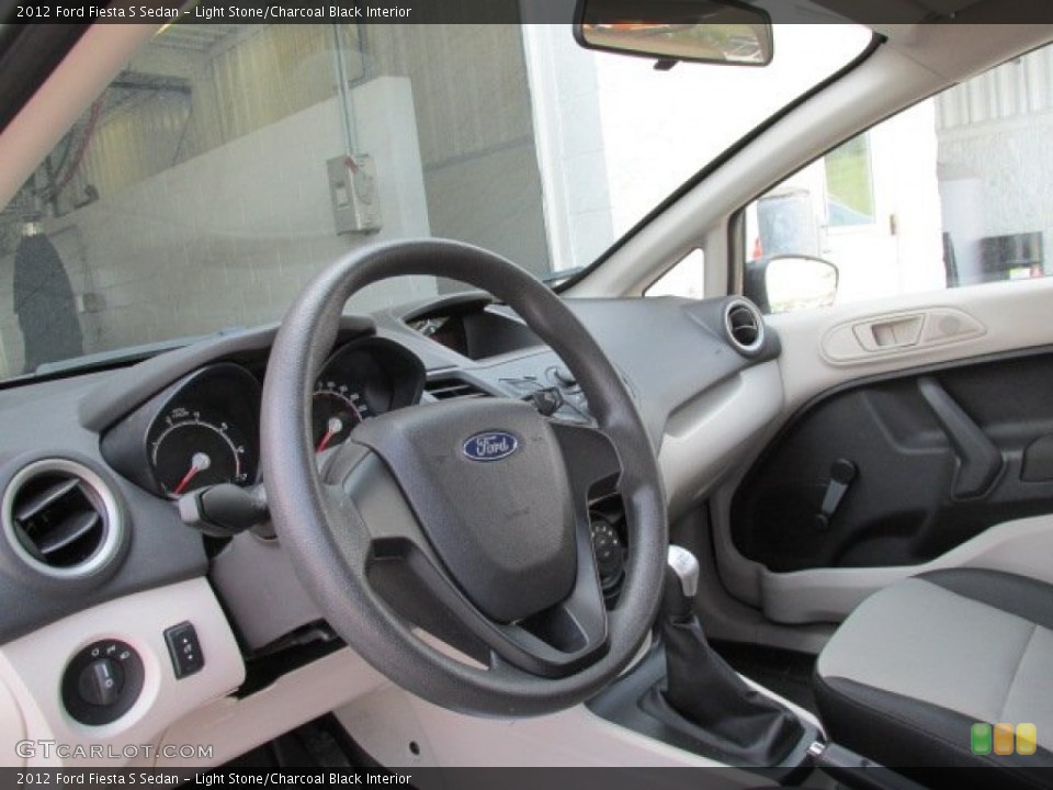 Light Stone/Charcoal Black Interior Dashboard for the 2012 Ford Fiesta S Sedan #81314687