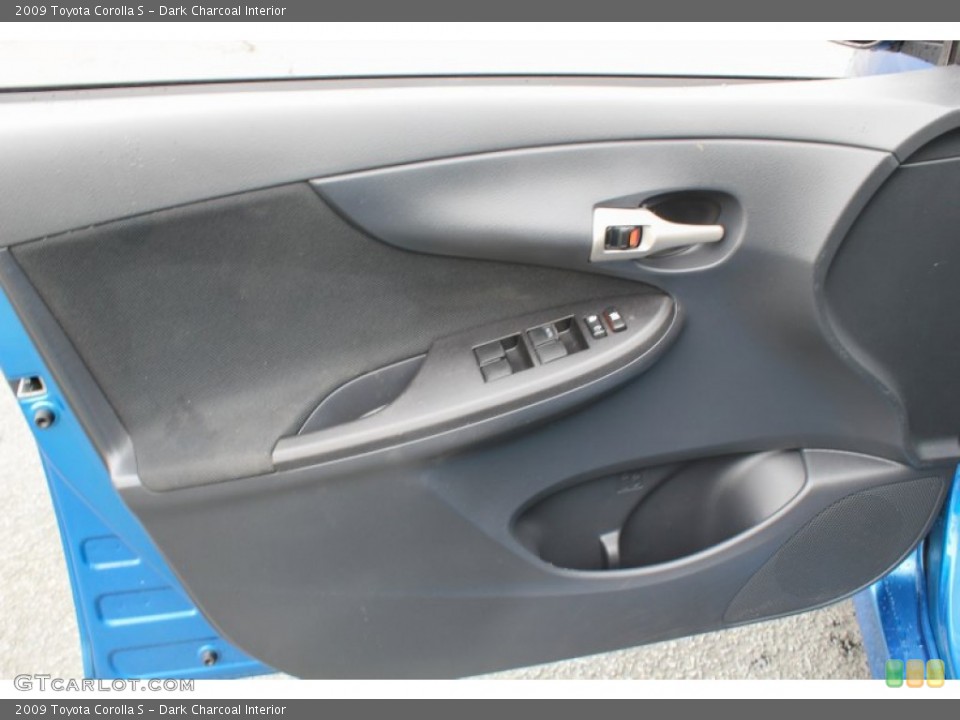 Dark Charcoal Interior Door Panel for the 2009 Toyota Corolla S #81349782