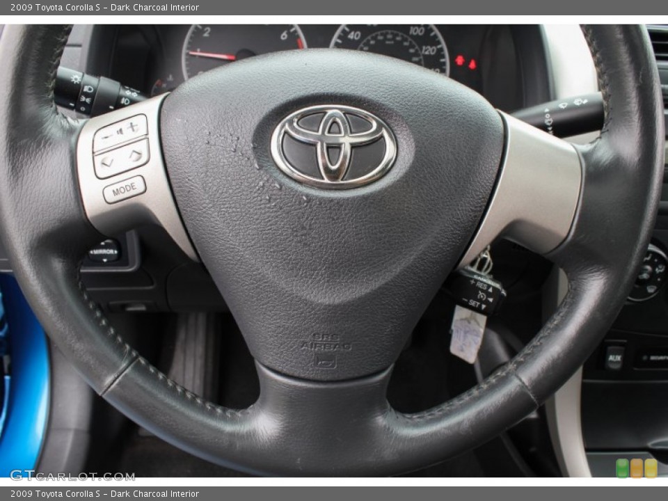 Dark Charcoal Interior Steering Wheel for the 2009 Toyota Corolla S #81349862