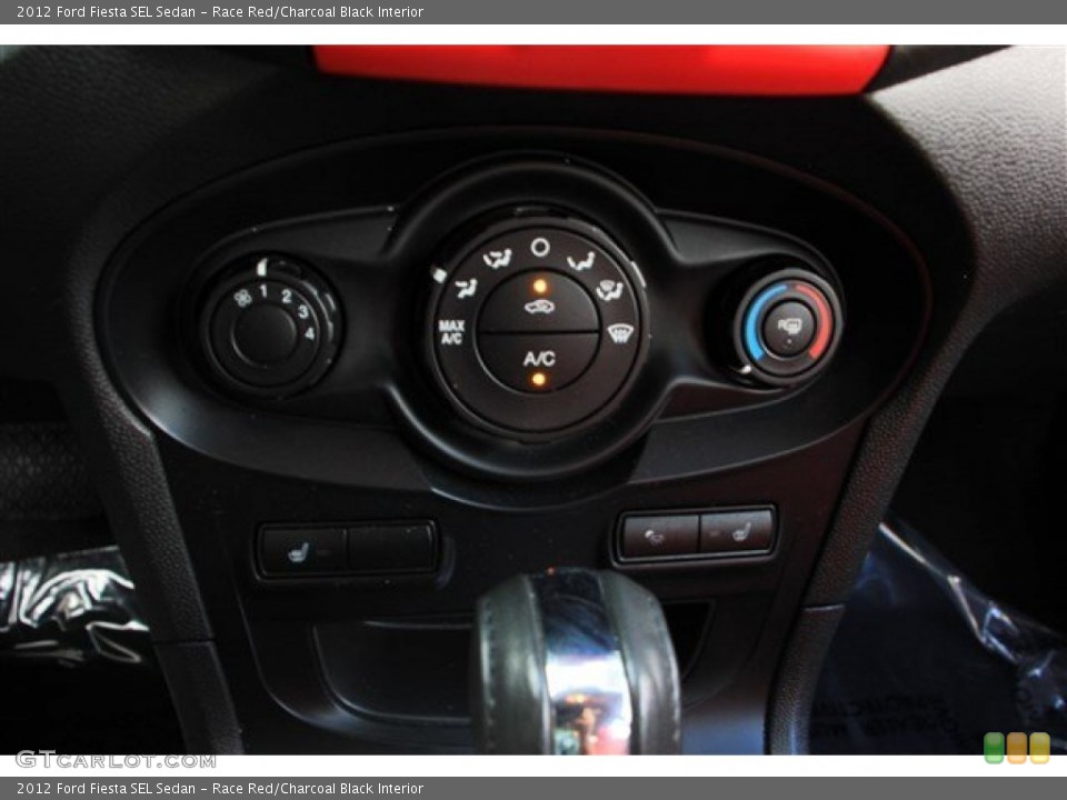 Race Red/Charcoal Black Interior Controls for the 2012 Ford Fiesta SEL Sedan #81946591
