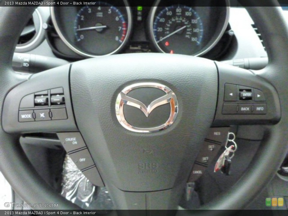 Black Interior Steering Wheel for the 2013 Mazda MAZDA3 i Sport 4 Door #82028206