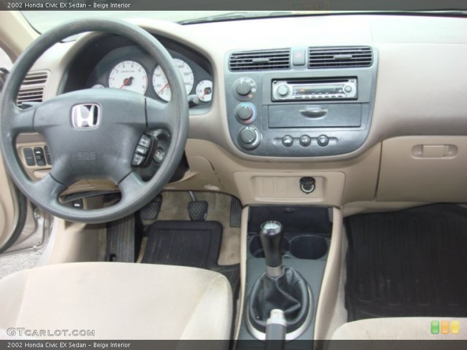 Beige Interior Dashboard for the 2002 Honda Civic EX Sedan #82108864