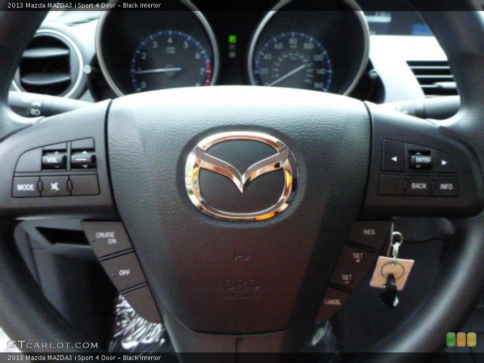 Black Interior Steering Wheel for the 2013 Mazda MAZDA3 i Sport 4 Door #82278368