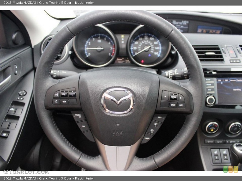 Black Interior Steering Wheel for the 2013 Mazda MAZDA3 i Grand Touring 5 Door #82370106