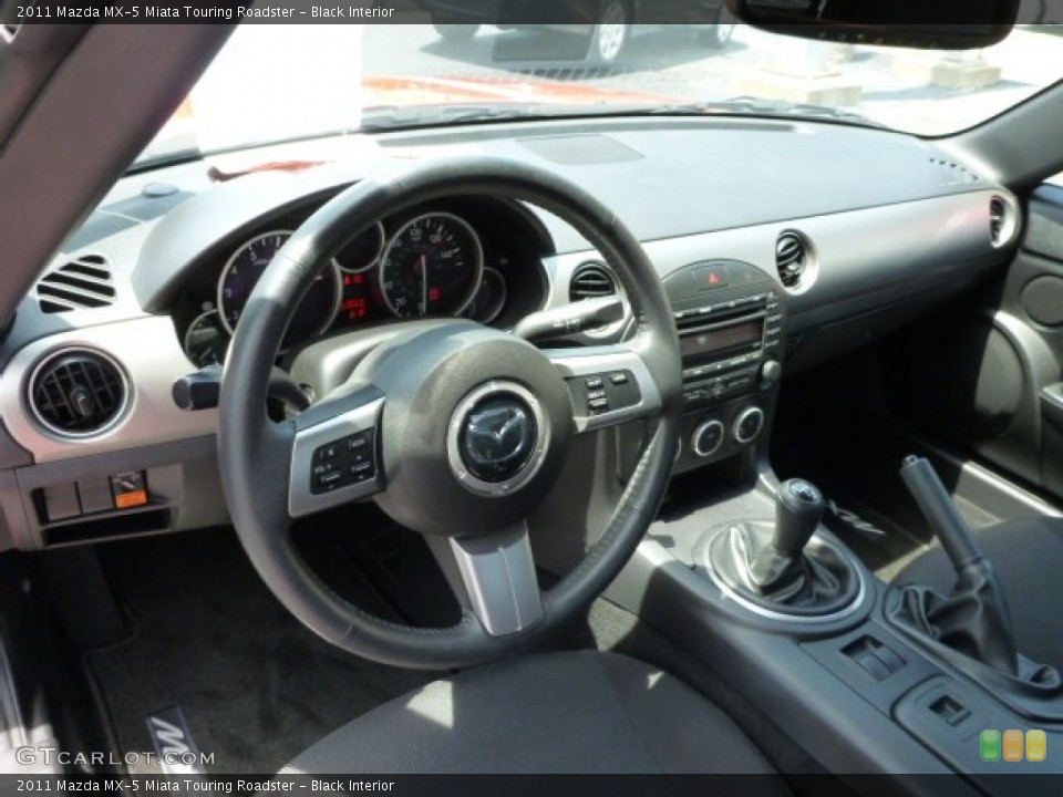 Black Interior Dashboard for the 2011 Mazda MX-5 Miata Touring Roadster #82403586