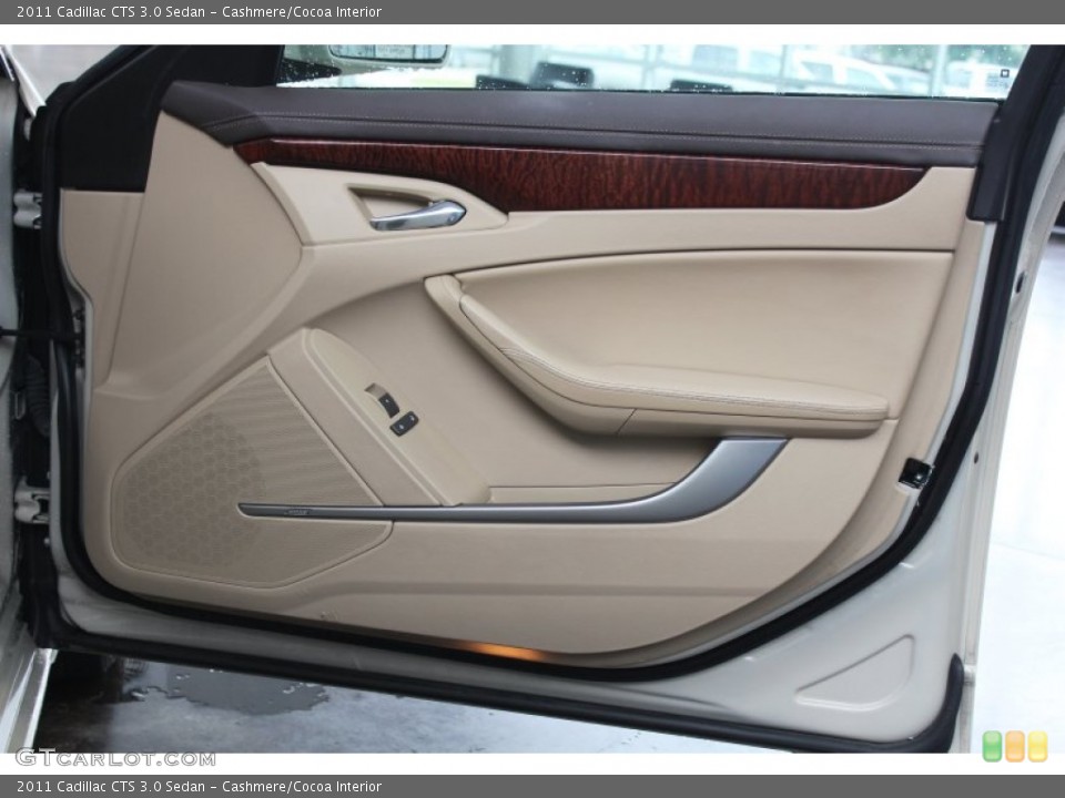 Cashmere/Cocoa Interior Door Panel for the 2011 Cadillac CTS 3.0 Sedan #82442529