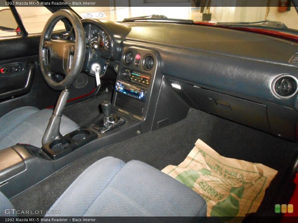 Black Interior Dashboard for the 1992 Mazda MX-5 Miata Roadster #82493861