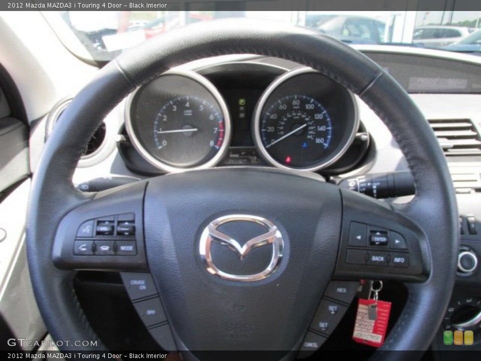 Black Interior Steering Wheel for the 2012 Mazda MAZDA3 i Touring 4 Door #82537869